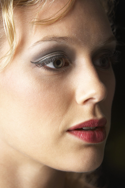 Young Woman Wearing Make-Up, Looking Thoughtful - Фото, зображення