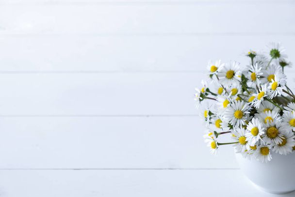 Beautiful bouquet of daisies in cup on white background - Foto, immagini