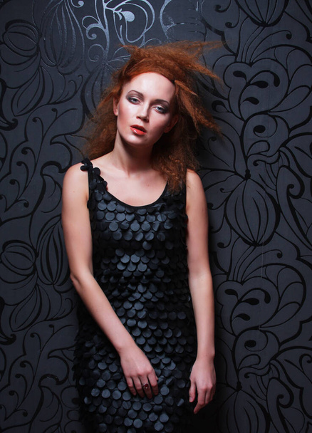 Portrait of beautiful fashion woman model with elegance make-up and curly red hair over dark background. - Zdjęcie, obraz