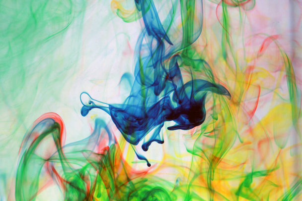 Colors. Abstract colors. backgrounds and textures. Food Coloring in water. Food coloring in water creating bright colorful abstract backgrounds. Colorful chemical experiment. Food coloring floats in a tank of water in a psychedelic pattern. - Photo, Image