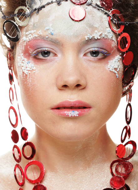 Party, New Year and Carnival concept: Beautiful winter snow queen. Young woman with creative make up and hairstyle over white background. Close up. - Valokuva, kuva