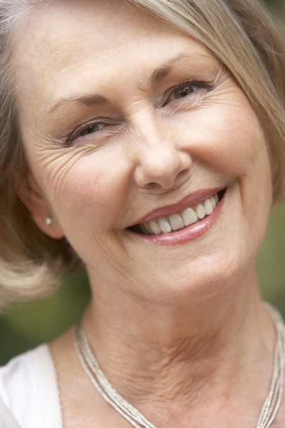 Portrait Of Senior Woman Smiling At Camera - Photo, image