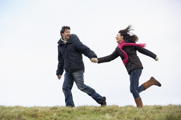 Couple Holding Hands And Running In The Park - Photo, Image