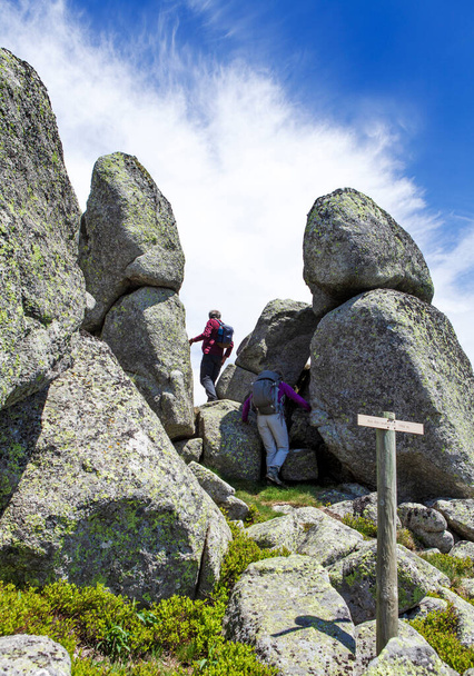 group of hikers and rocks formation - 写真・画像