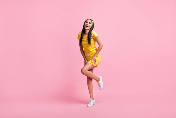 Full length portrait of attractive positive person bent leg vintage dotted outfit isolated on pink color background - Zdjęcie, obraz