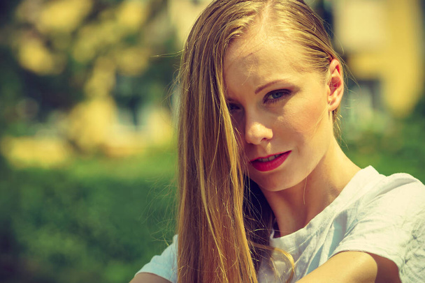 Portrait of young woman, teen girl with long blond hair outdoors - Fotoğraf, Görsel