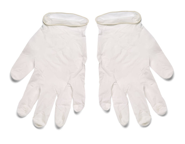 close-up van witte latex beschermende handschoenen op witte achtergrond - Foto, afbeelding