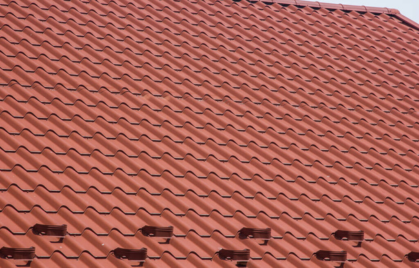 the roof of the house in which modern roofing materials are used - Photo, Image