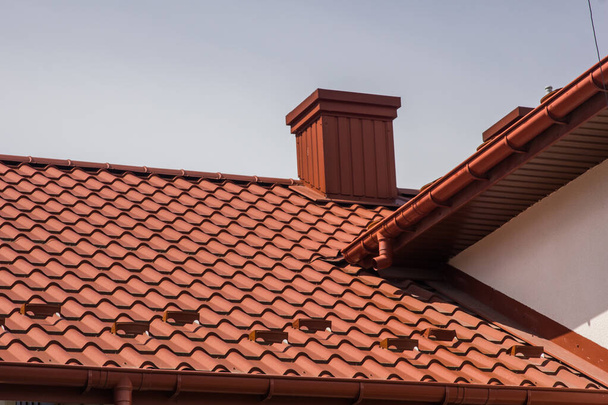 the roof of the house in which modern roofing materials are used - Photo, image