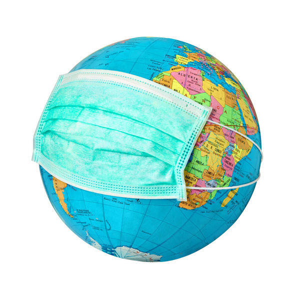 close up of a globe with a protective mask on white background - Photo, Image
