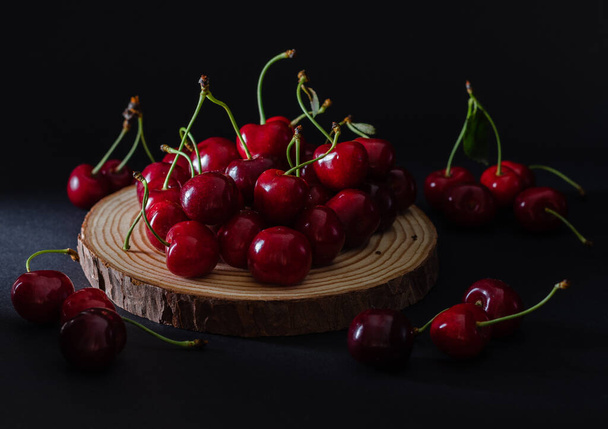 Ripe cherry on dark background. Close up view. - Valokuva, kuva
