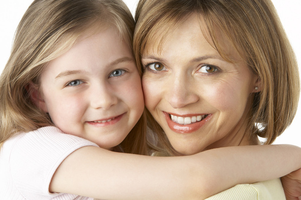 Mother And Daughter Smiling And Hugging - 写真・画像