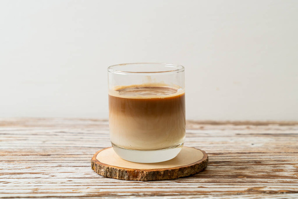 glass of latte coffee, coffee with milk on wood background - Foto, Bild