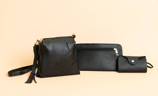 black leather hand bag and black leather card bag - Photo, image