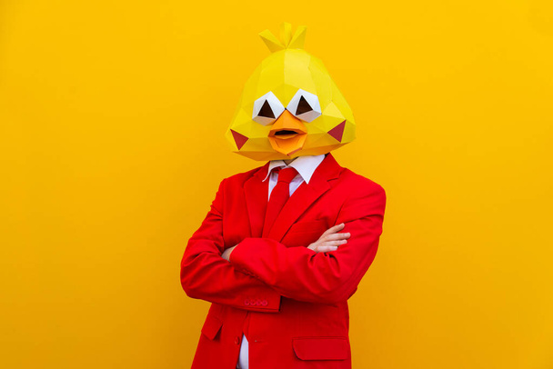 Cool man wearing 3d origami mask with stylish colored clothes - Creative concept for advertising, animal head mask doing funny things on colorful background - Foto, Bild
