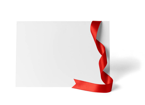close up of a  blank folded leaflet or a desktop calendar with ribbon on white background  - Photo, Image