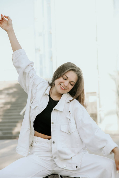 Vertical portrait of happy young woman, wears white clothing. Lifestyle concept. - Foto, afbeelding