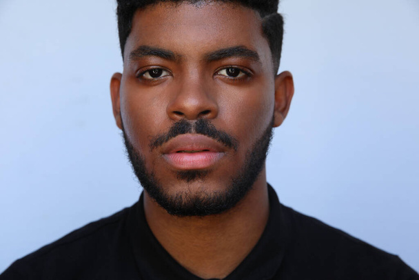 Cropped image of handsome young black man looking a side on white background. - Zdjęcie, obraz