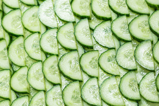 Fresh green slices of cucumber as background. Top view.  - Fotoğraf, Görsel