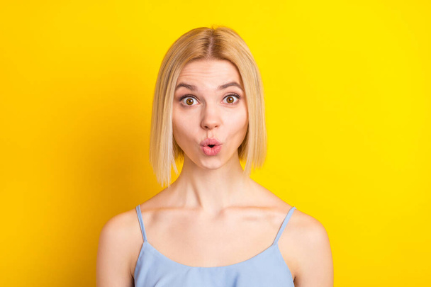 Photo of impressed blond short hair lady wear blue top isolated on vivid yellow color background - Fotografie, Obrázek