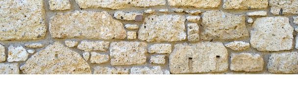 Sturdy yellow and beige cut stone wall, good for backgrounds, seamless lined up - Photo, Image
