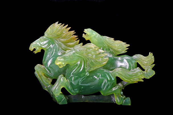 Jade carving : three horses running sculpture (Nephrite jade) isolated on black background - Photo, Image
