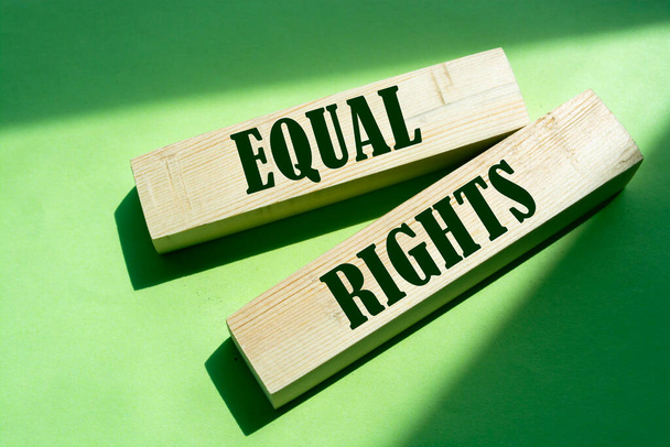 Equal Rights, words on wooden blocks on green background. Equality social concept. - Foto, Imagen