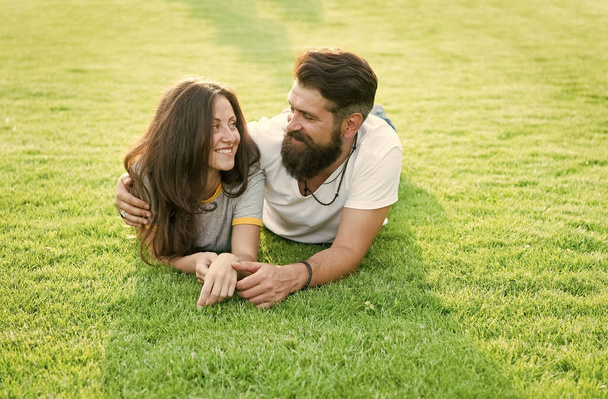 Happy summer. Happy family relax on green grass. Couple in love dating on natural landscape. Happy vacation. Family recreation. Enjoyment and relaxation. Being happy together - Fotoğraf, Görsel