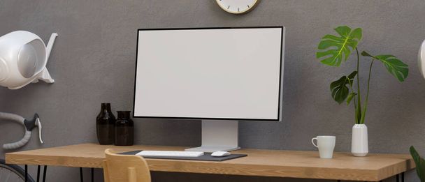 Monitor komputerowy z makietą na biurku w nowoczesnej przestrzeni roboczej z dekoracjami i rowerem, renderowanie 3D, ilustracja 3D - Zdjęcie, obraz