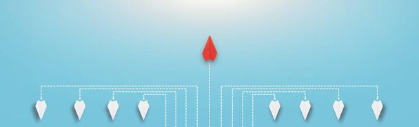 Concepts of new strategy, creativity, different opinions, and new innovation. Photographs of red origami paper planes flew apart from the group on a blue background with copy space. - Fotó, kép