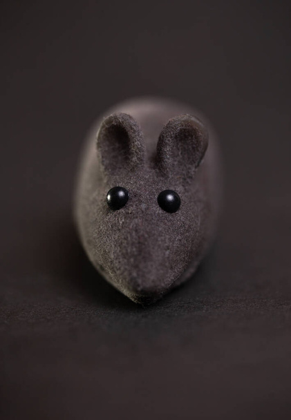 toy gray mouse for cats on a dark background. - Photo, Image