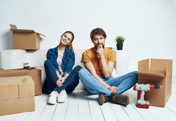 Young family boxes with things moving housewarming - Photo, Image