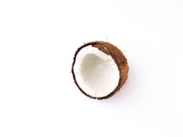 A closeup of a half coconut isolated on a white background with space for text - Valokuva, kuva