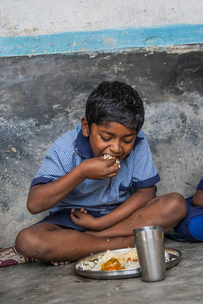 Indian Rural School Boy having lunch - Photo, Image