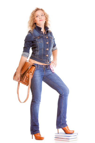 Full length student girl in blue jeans bag books - Foto, Imagem