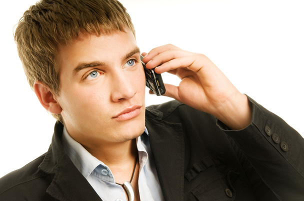 Jeune bel homme parlant au téléphone - Photo, image