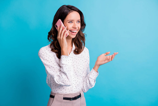 Profile photo of optimistic brunette girl talk telephone wear shirt isolated on teal color background - Fotó, kép