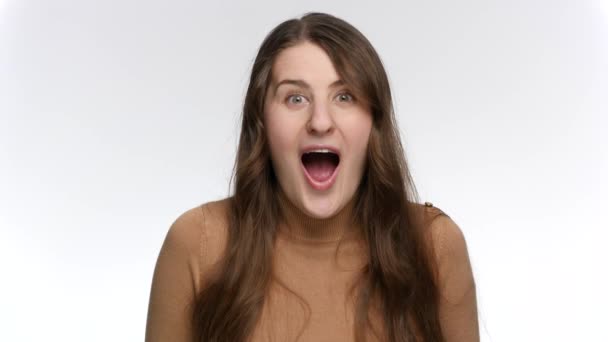 Portrait of amazed and surprised woman saying Wow. Positive emotions and surprised face expression - Footage, Video