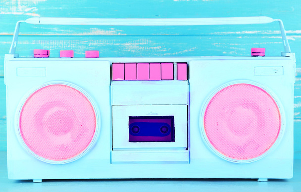 Colorful retro radio, on blue wooden background - Фото, изображение