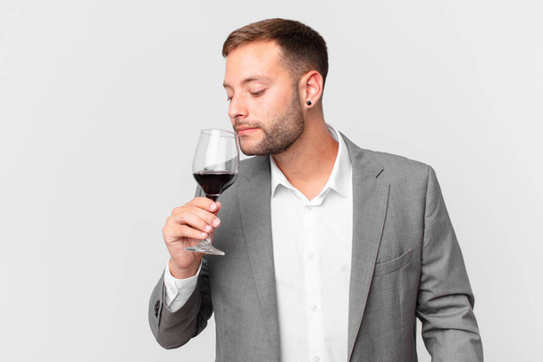 handsome businessman having a wine - Foto, afbeelding