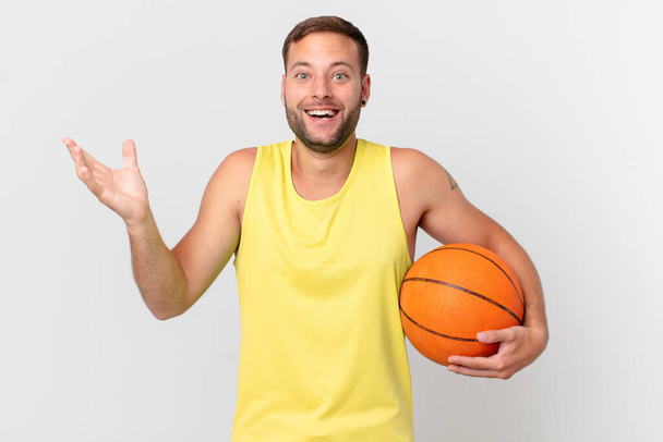 handsome man with a basketball ball - Photo, Image