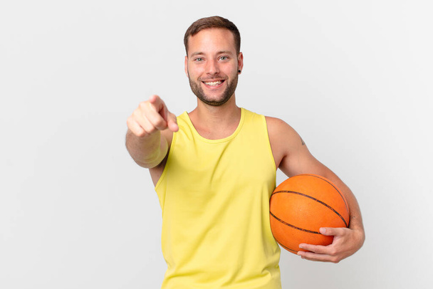 handsome man with a basketball ball - Fotó, kép