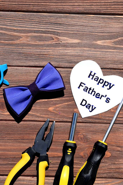 Composition with tools on a wooden background. Happy Father's Day - Photo, Image
