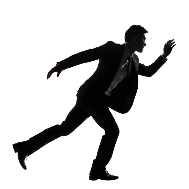Silhouette of Asian business man running - Фото, изображение