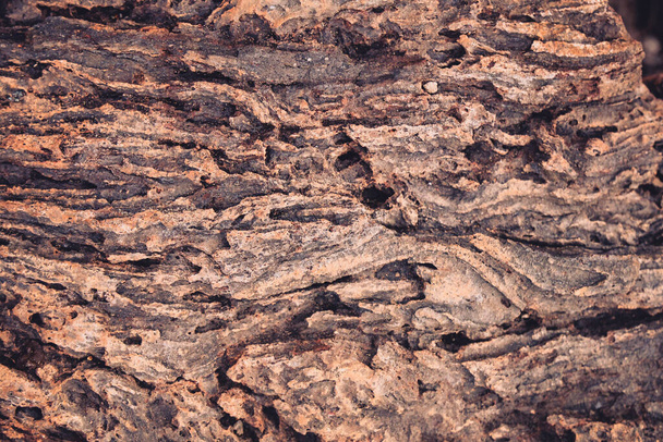 A sivatagban talált vulkanikus lávaszikla bazalt közeli részletei - Fotó, kép