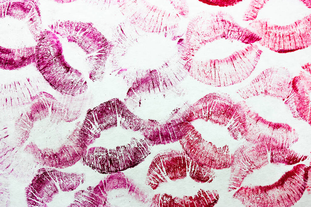 Pink kisses isolated on white background. Lots of female lip prints flatly. - Photo, Image
