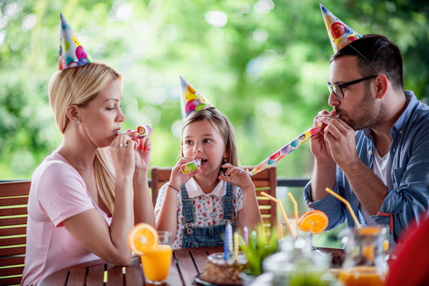 Family celebrating birthday at home. Family, birthday, love and lifestyle concept. - Photo, Image
