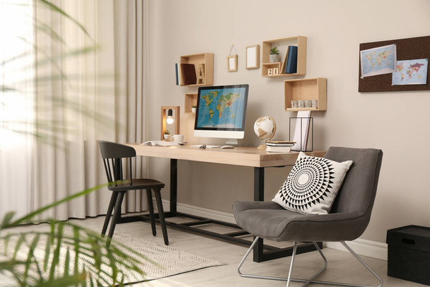 Room interior with comfortable workplace. Modern computer on wooden desk - Foto, Imagem