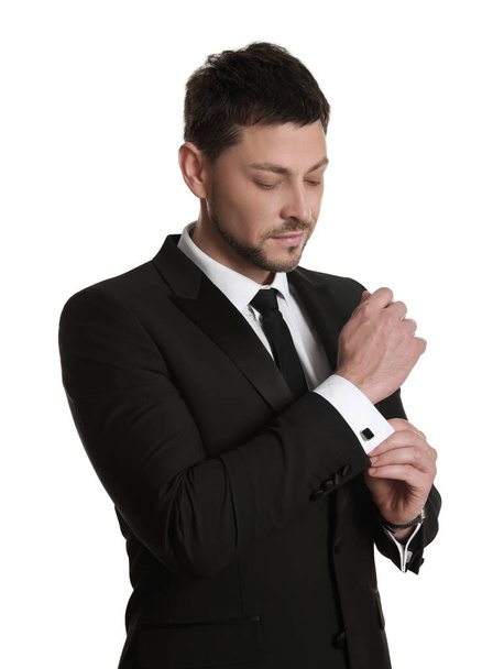 Man wearing stylish suit and cufflinks on white background - Foto, Imagen