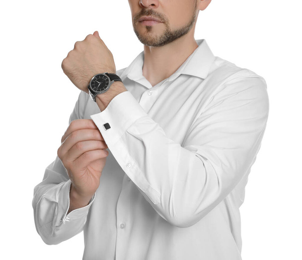 Man wearing stylish shirt and cufflinks on white background, closeup - Foto, Imagen